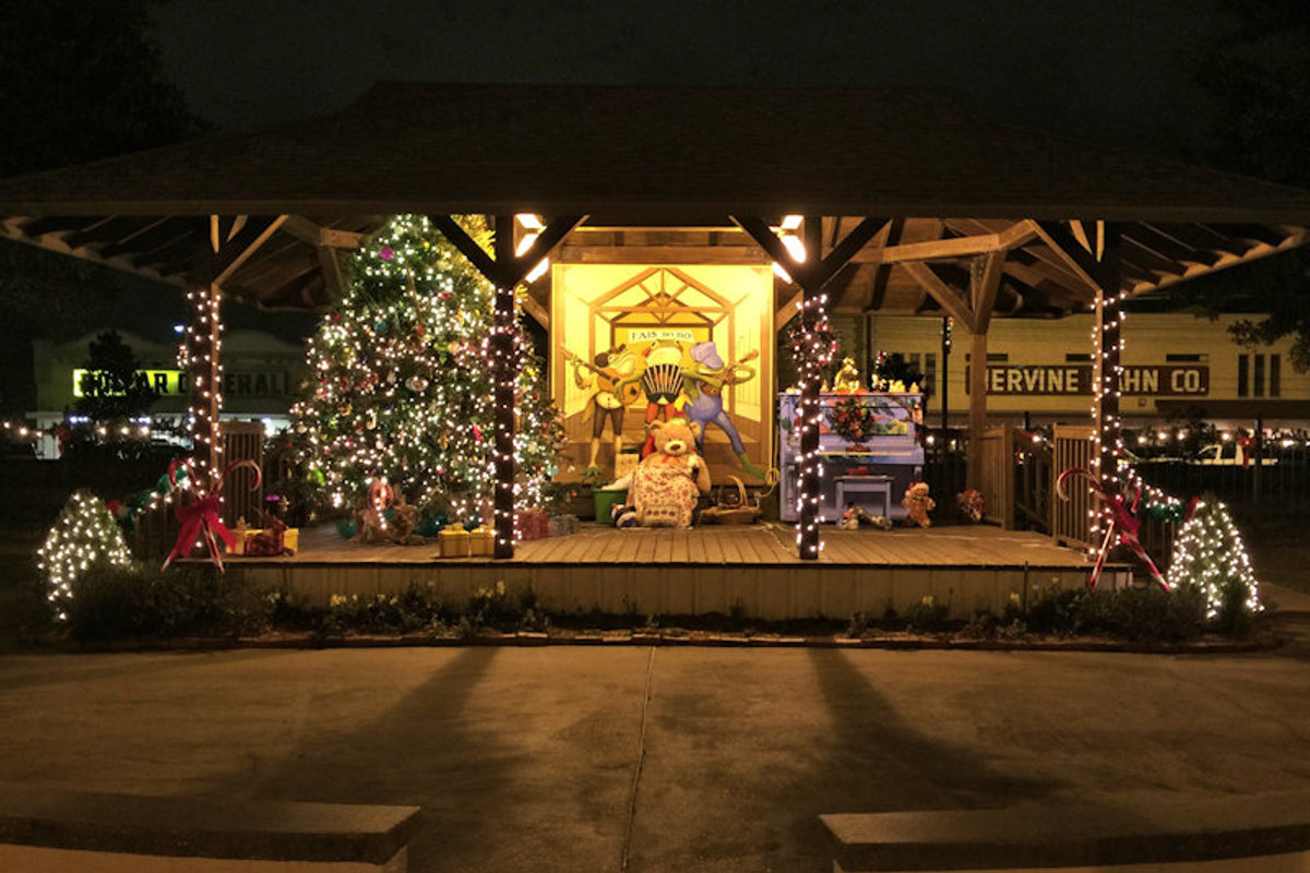Depot Square pavilion in Rayne decorated with a lit Christmas tree and holiday lights in the evening.