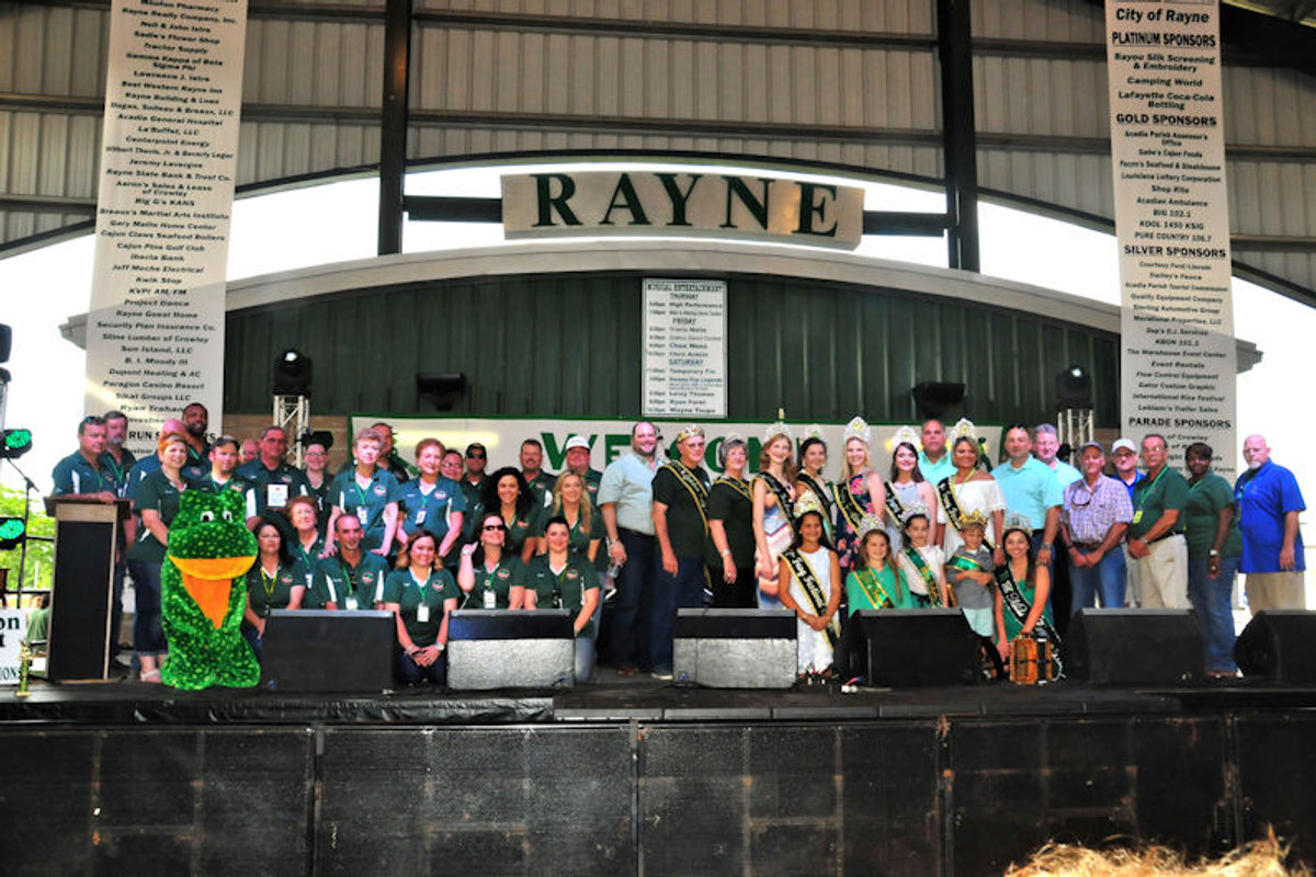 The Rayne Frog Festival court and frog mascot on stage during the annual celebration.